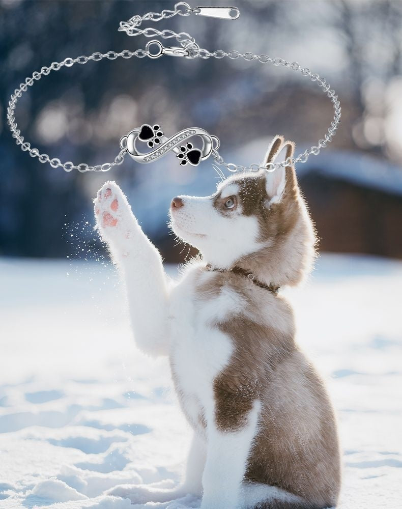 Uendelighedssymborin med poteaftryk charm og zirkonia